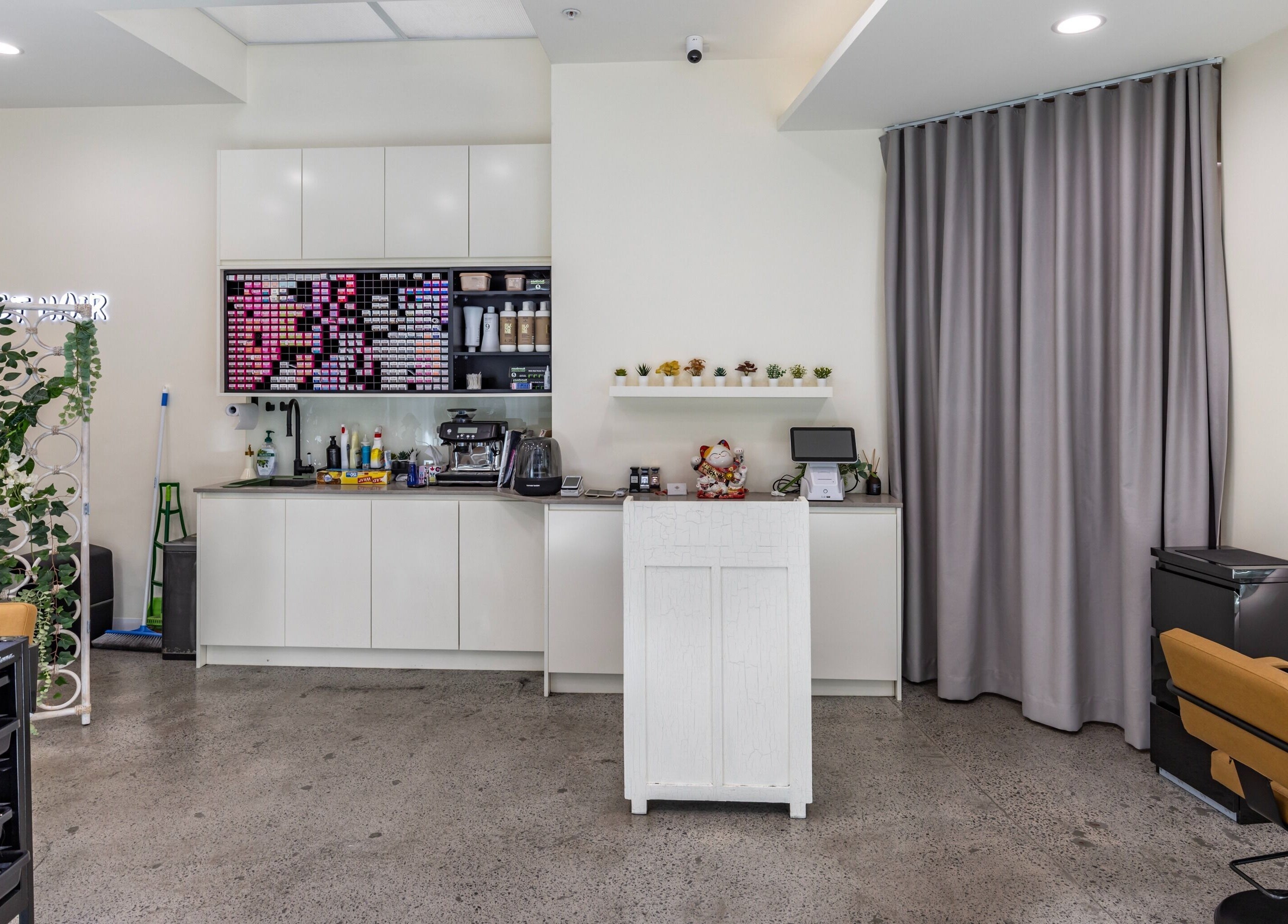 Modern interior of Project Hair Salon in Chippendale, NSW, AU, with sleek counters and vibrant decor.