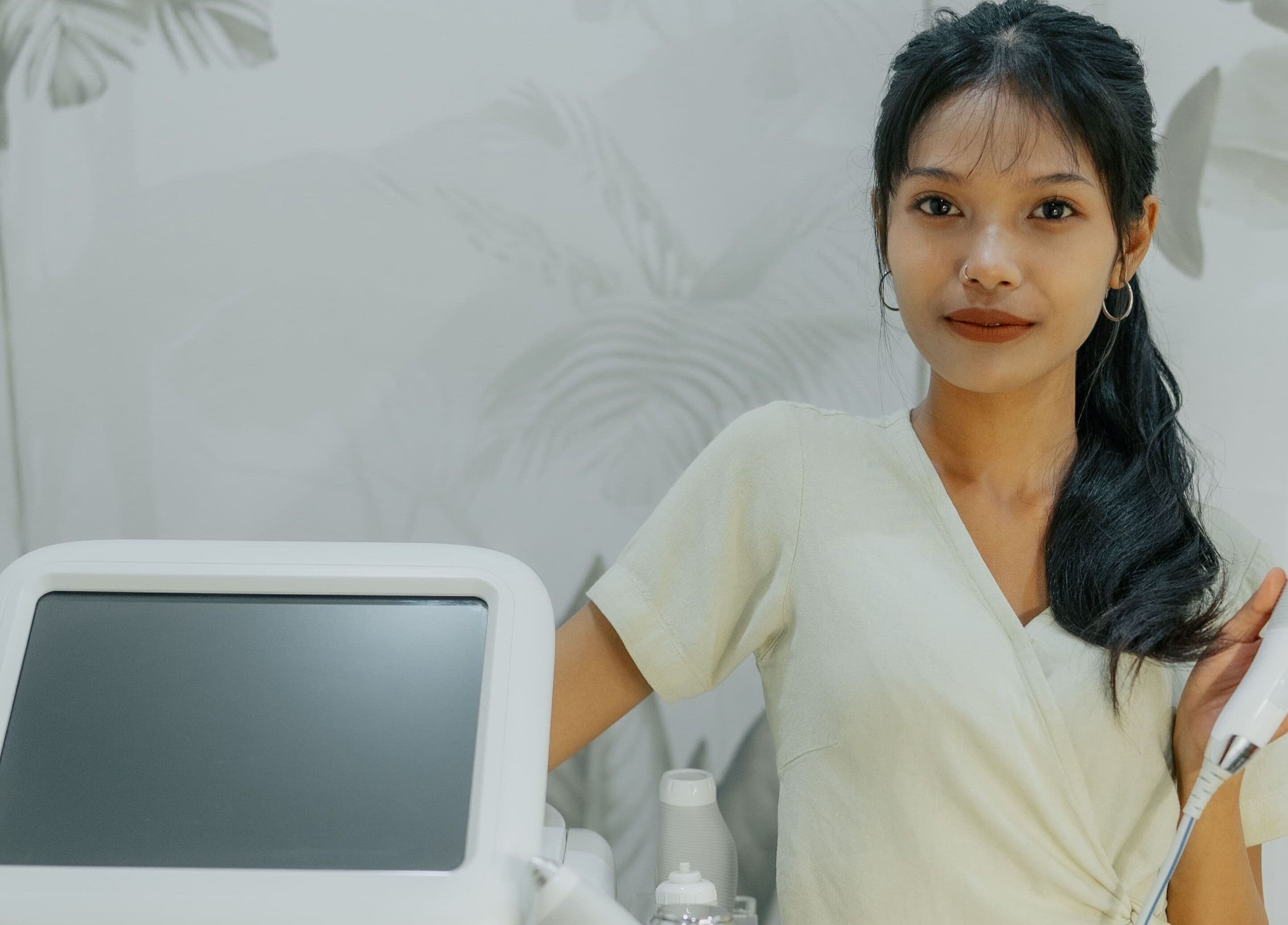 Skilled therapist at Beam & Bare using advanced facial device in Bali, Bali, ID.