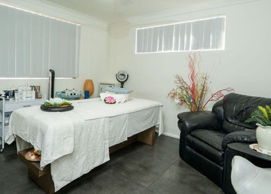 Tranquil massage room at Tran Spa and Massage, Stretton, Queensland, AU with a cozy bed and soothing decor.
