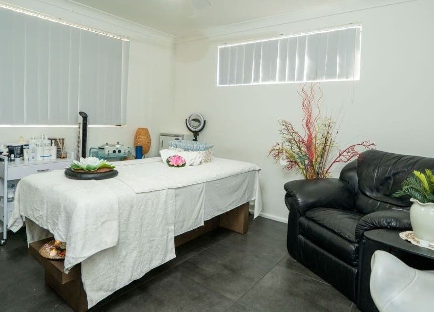 Tranquil massage room at Tran Spa and Massage, Stretton, Queensland, AU with a cozy bed and soothing decor.