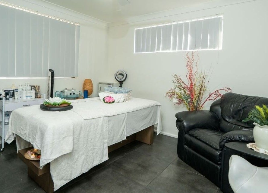 Tranquil massage room at Tran Spa and Massage, Stretton, Queensland, AU with a cozy bed and soothing decor.