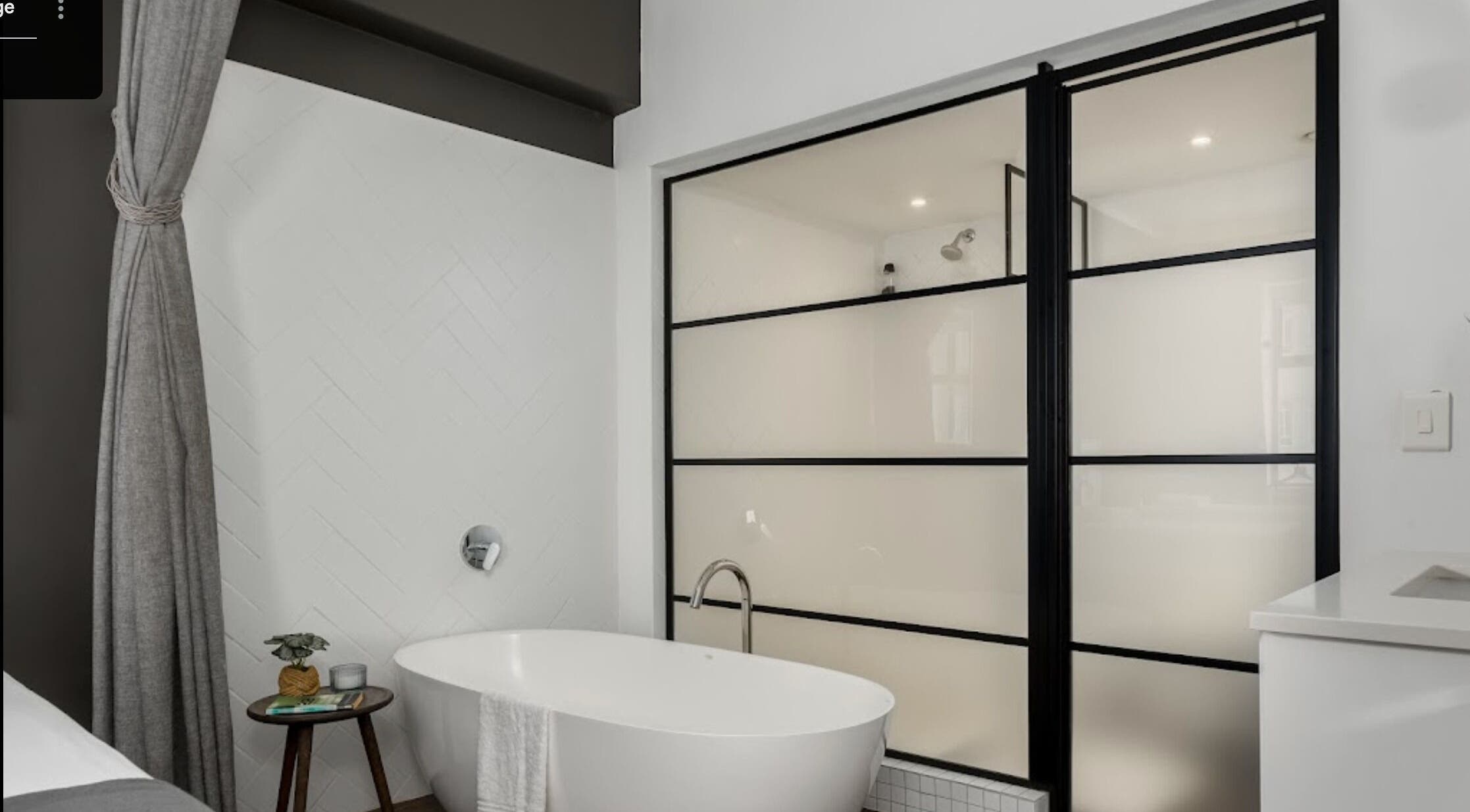 Elegant bathtub in minimalistic decor at More Massage, Cape Town, Western Cape, ZA, offering relaxation.