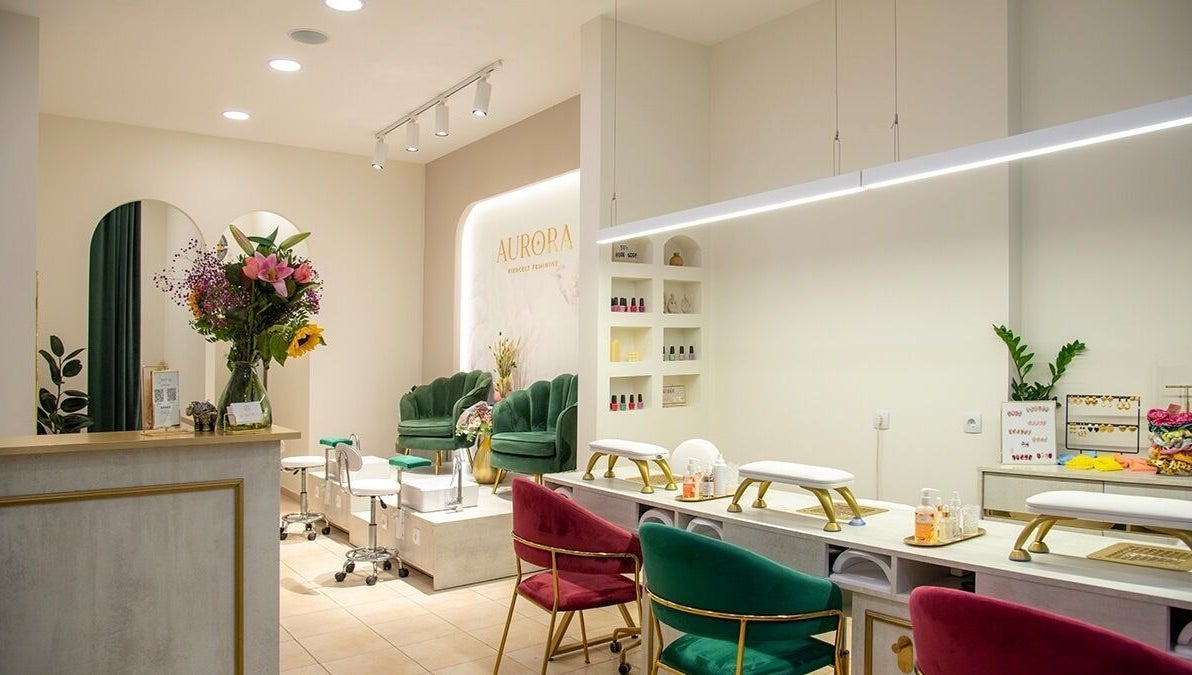 Elegant interior of Aurora Fiercely Feminine, Chalkis, GR, showcasing stylish seating and decor.