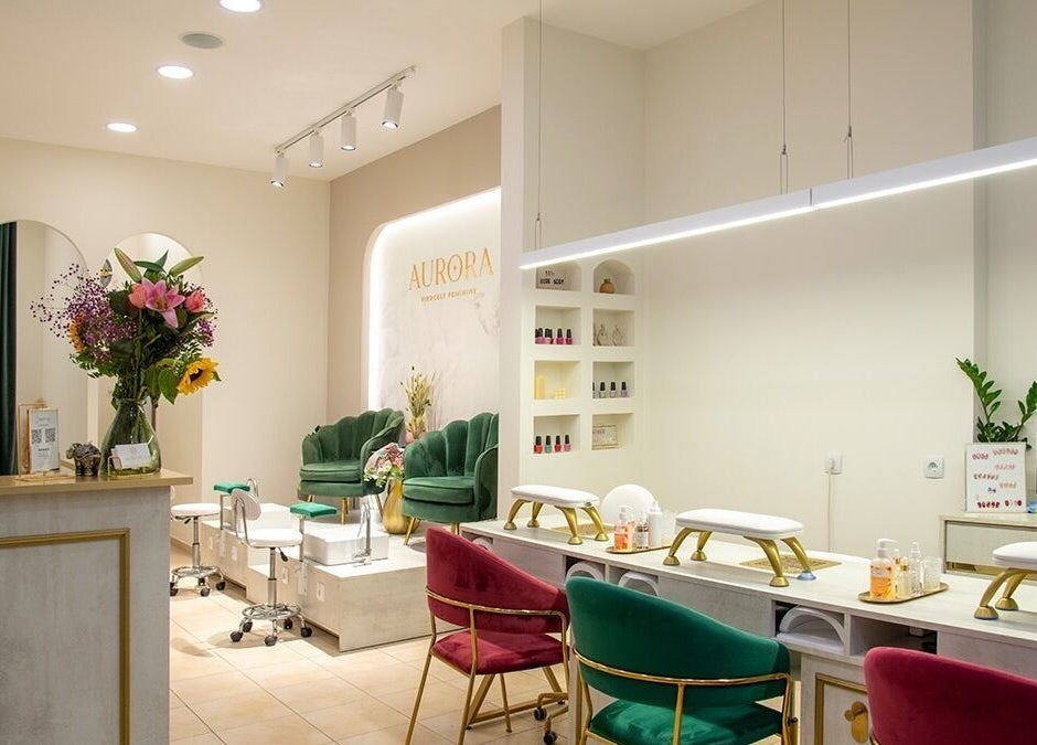 Elegant interior of Aurora Fiercely Feminine, Chalkis, GR, showcasing stylish seating and decor.