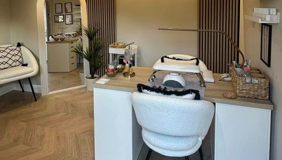 Elegant nail station at Nails by Ezme, Ashford, England. Cozy space with modern decor for relaxation.