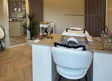 Elegant nail station at Nails by Ezme, Ashford, England. Cozy space with modern decor for relaxation.