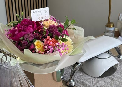Beautiful floral arrangement at Nails by Ezme, Ashford, England, GB, enhances the manicure station decor.