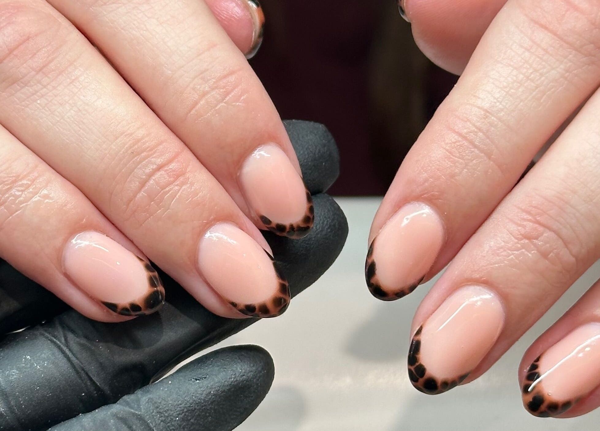 Stylish leopard print nail art at Nails by Ezme in Ashford, England, GB. Perfect for a trendy look.