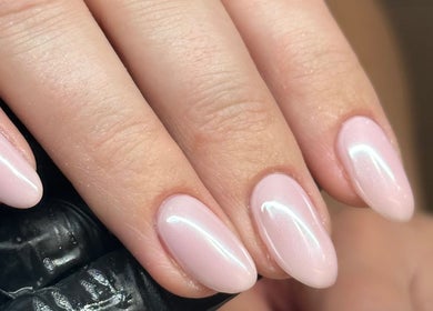 Elegant pink gel manicure at Nails by Ezme, Ashford, England, GB, showcasing exquisite nail art.
