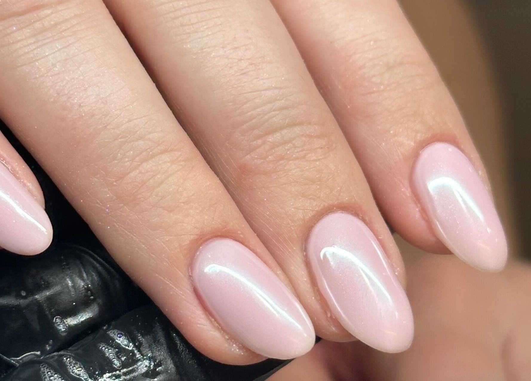 Elegant pink gel manicure at Nails by Ezme, Ashford, England, GB, showcasing exquisite nail art.