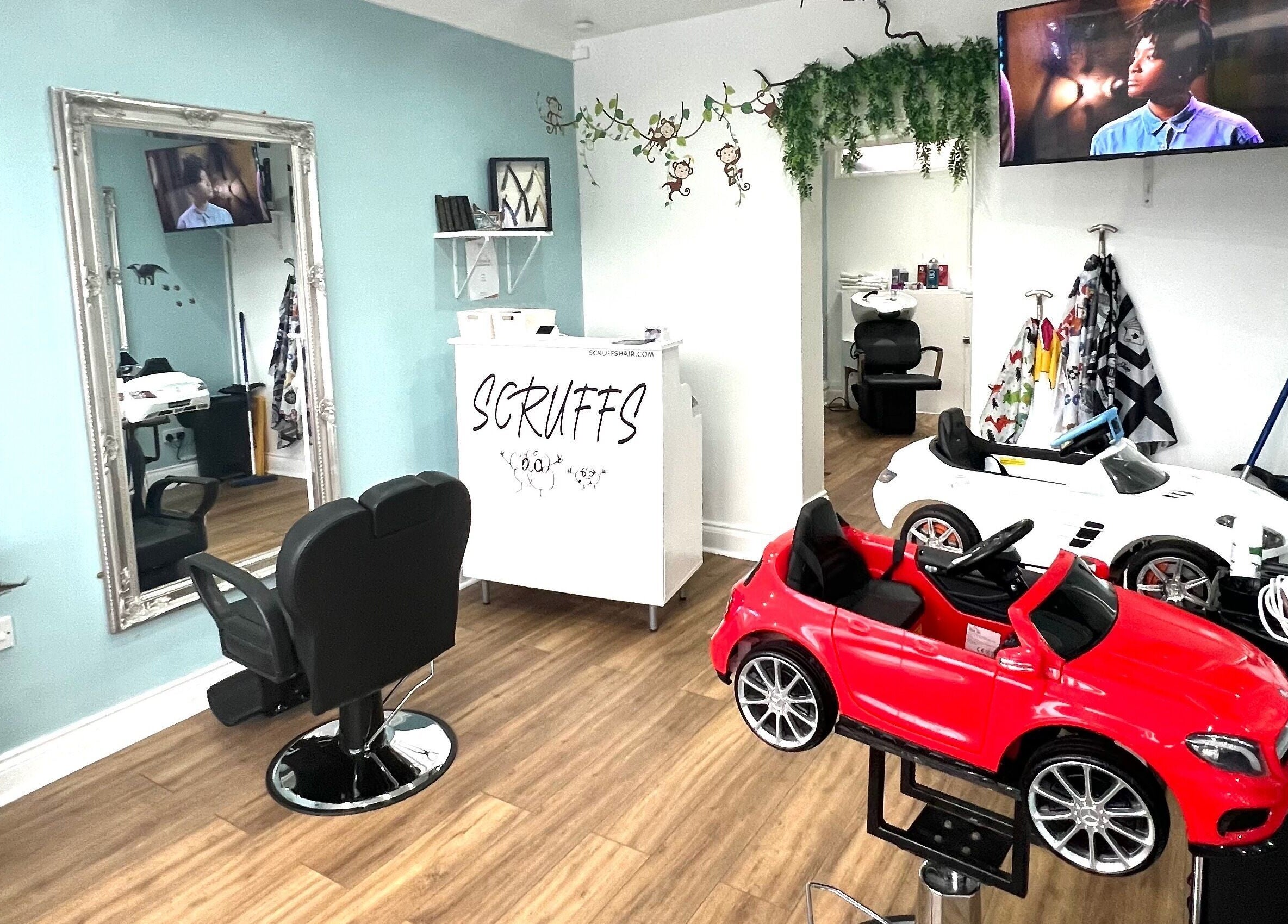 Bright interior of Scruffs salon in Litherland, England, GB featuring stylish seating and decor.