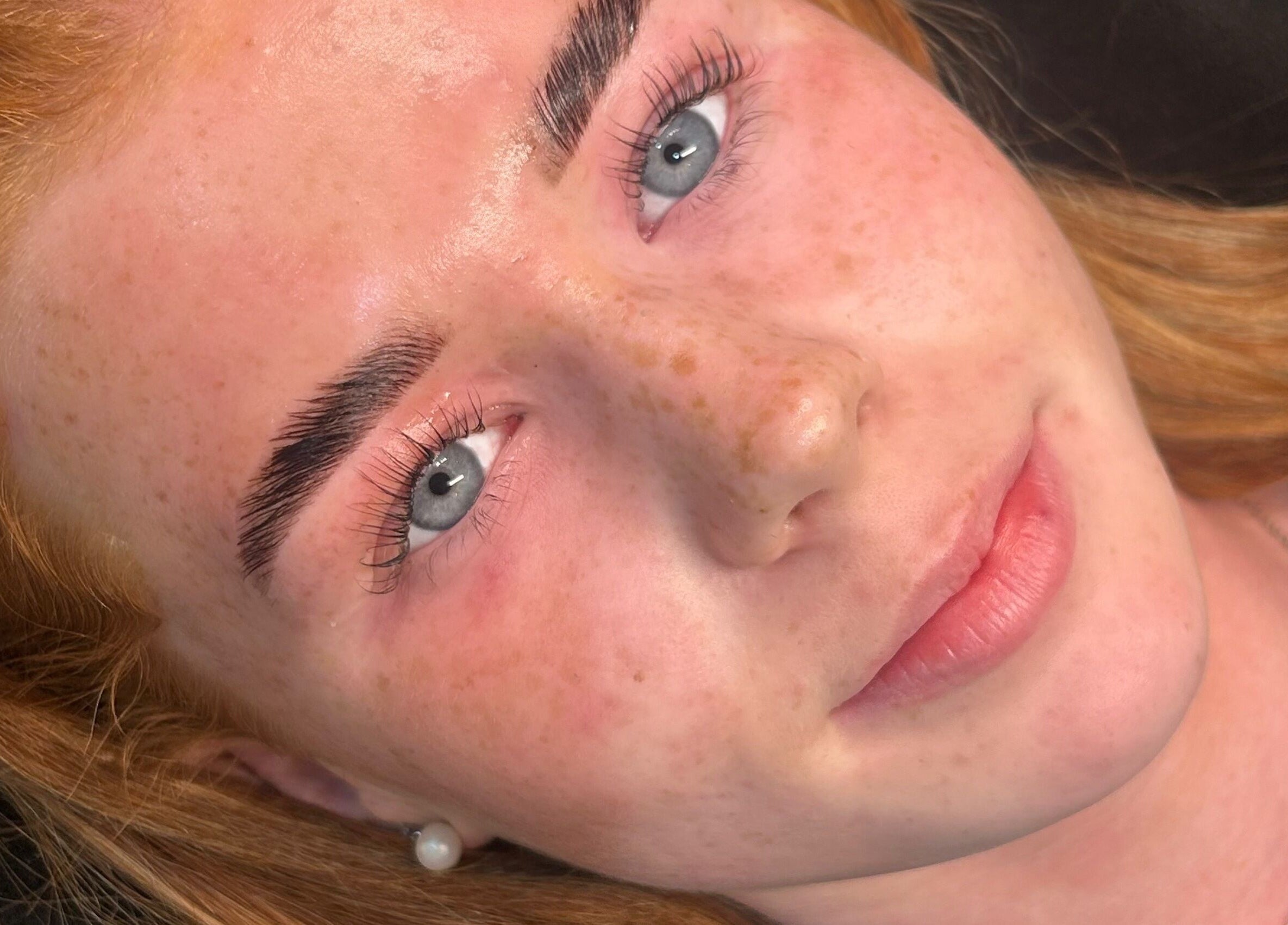 A woman with radiant skin after treatment at Mfb Beauty, Harlow, England, GB.