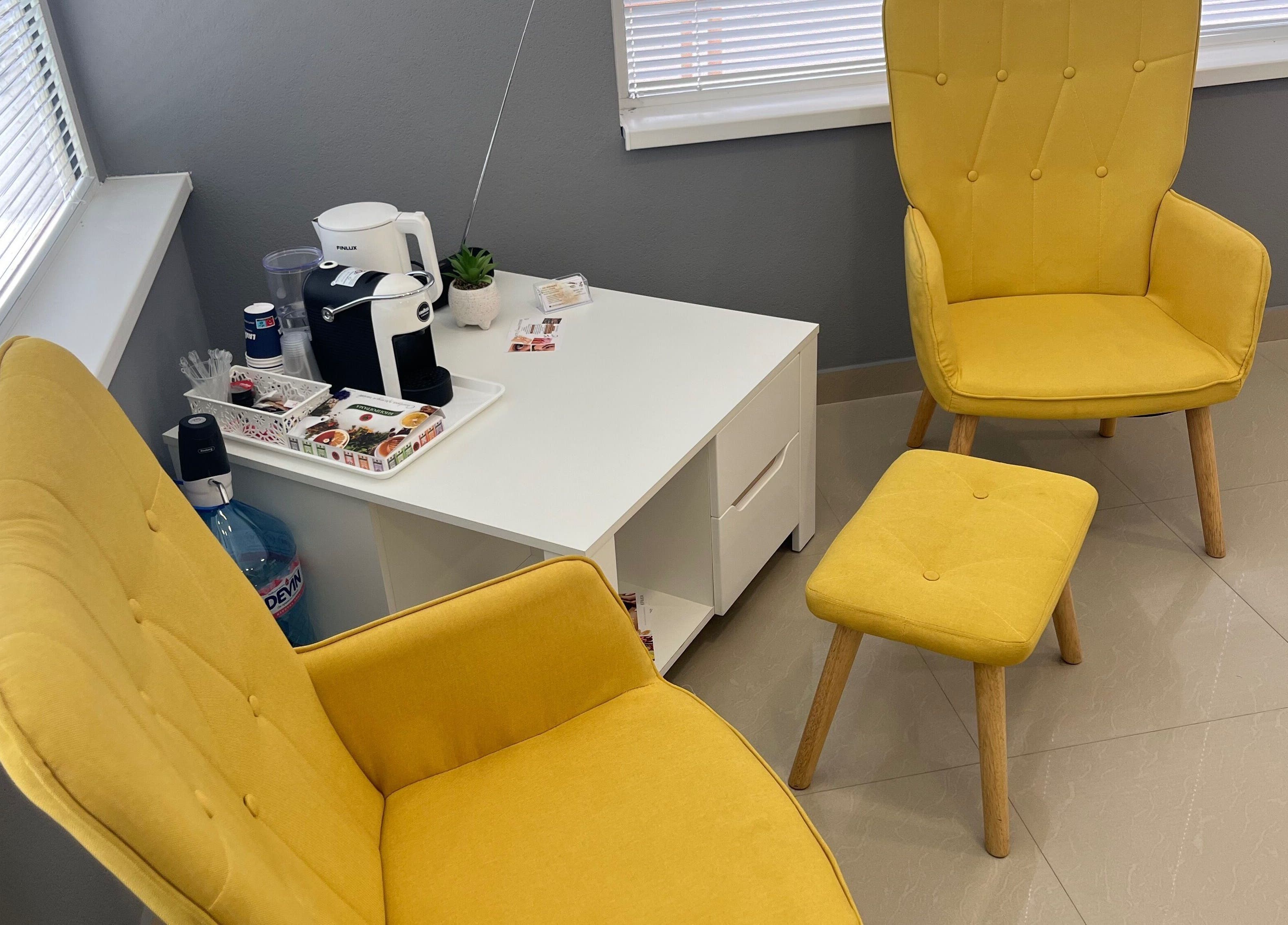 Comfortable yellow chairs at Brows Simona, Sandanski, Blagoevgrad, BG, creating a welcoming ambiance.