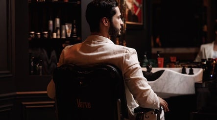 Sophisticated barber chair at Verve Barbershop, Dubai, Dubai, AE, with gentleman in focus.