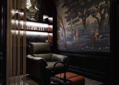 Luxurious lounge at Verve Barbershop in Dubai, Dubai, AE, featuring a reclining chair and elegant decor.