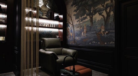 Luxurious lounge at Verve Barbershop in Dubai, Dubai, AE, featuring a reclining chair and elegant decor.