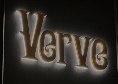 Illuminated Verve Barbershop sign at Dubai, Dubai, AE, highlighting stylish ambiance.