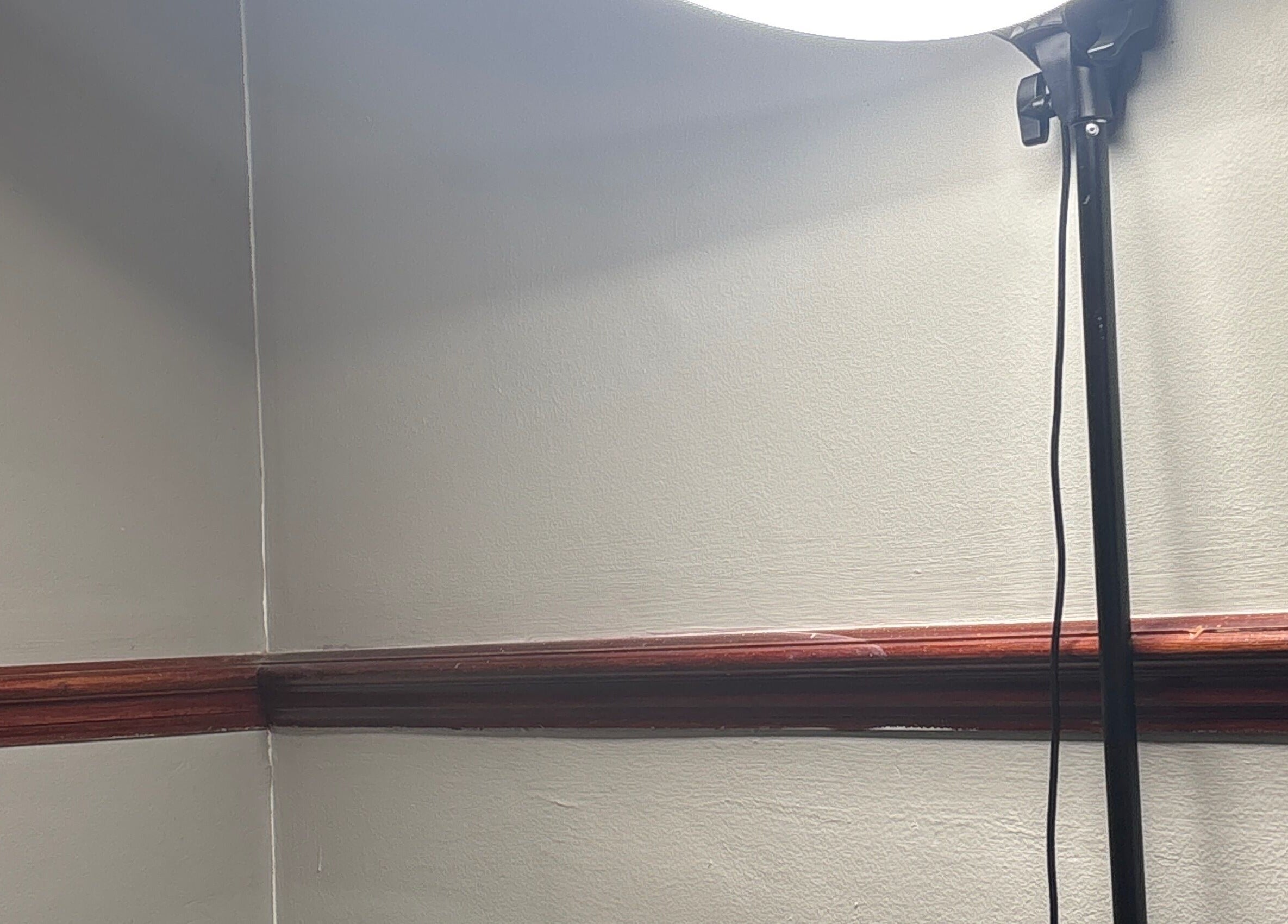 A bright floor lamp illuminating the corner at The.GloLounge, Wittering, England, GB.