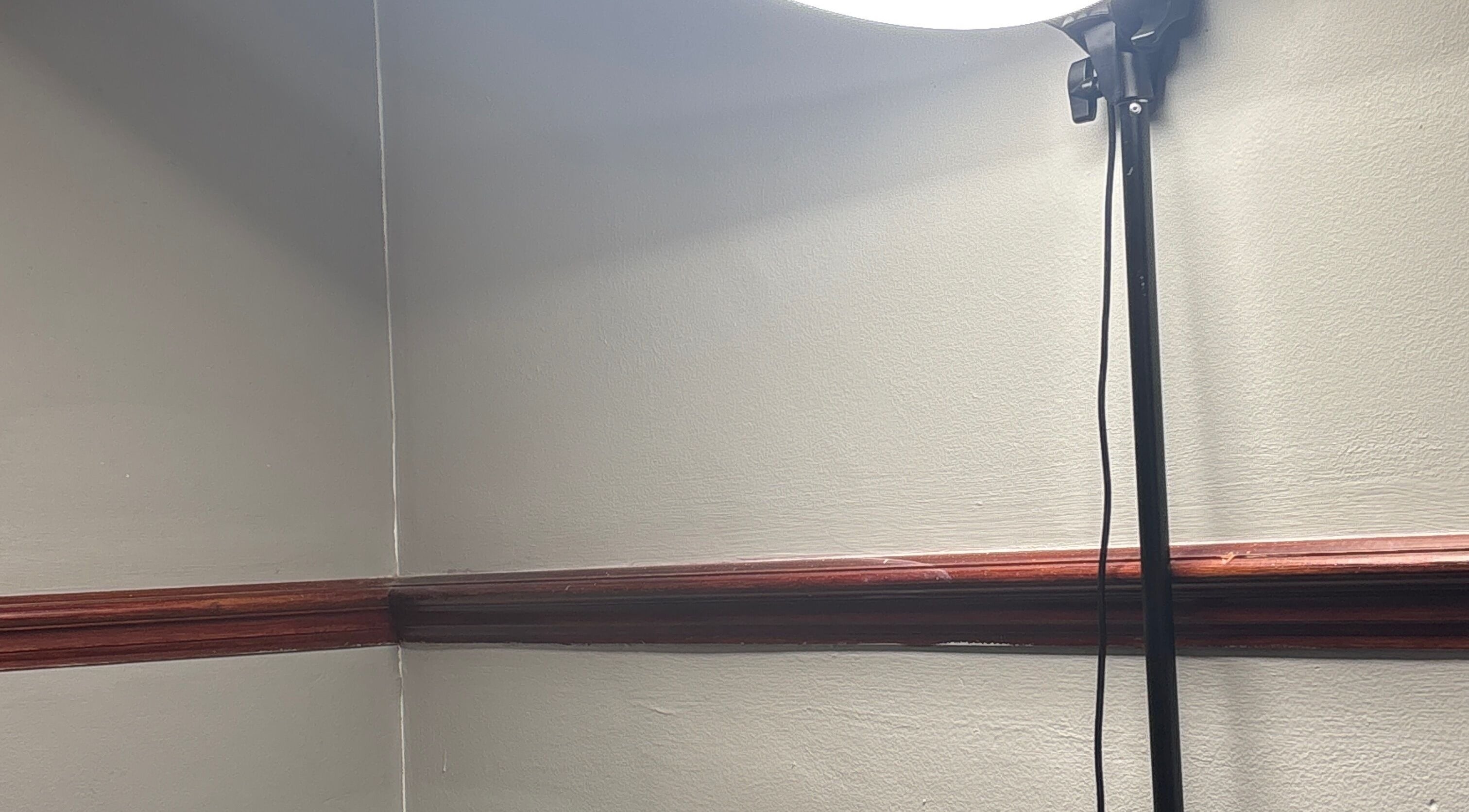 A bright floor lamp illuminating the corner at The.GloLounge, Wittering, England, GB.