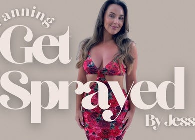 Woman in floral dress at Get Sprayed, Exeter, England, promoting spray tanning services.