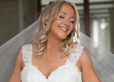 Happy bride at Get Sprayed, Exeter, England, GB, showcasing elegant bridal look.