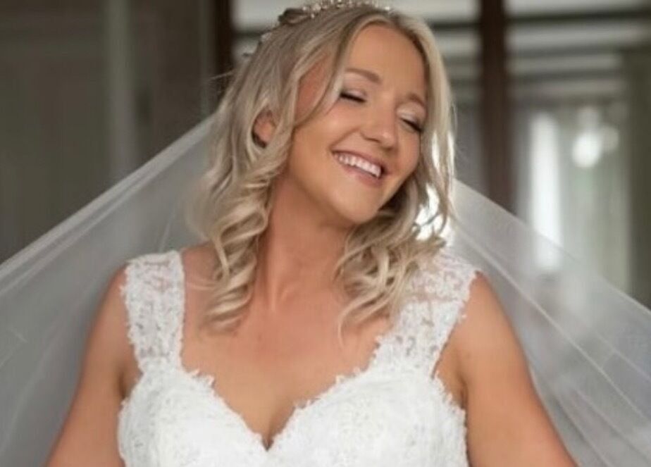 Happy bride at Get Sprayed, Exeter, England, GB, showcasing elegant bridal look.