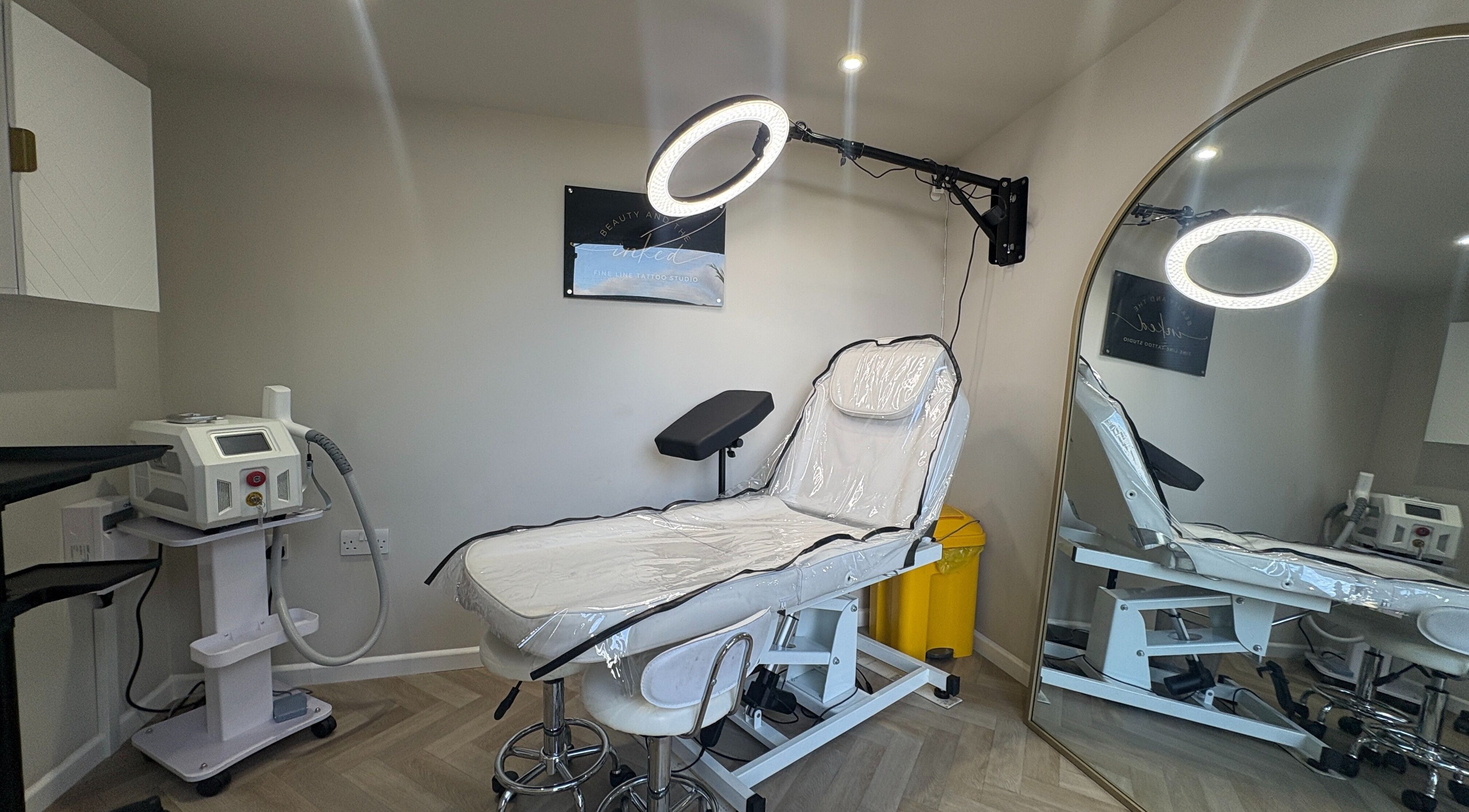 Beauty and the Inked studio in Bradford, GB, featuring a tattoo chair and laser equipment for fine line tattoos.