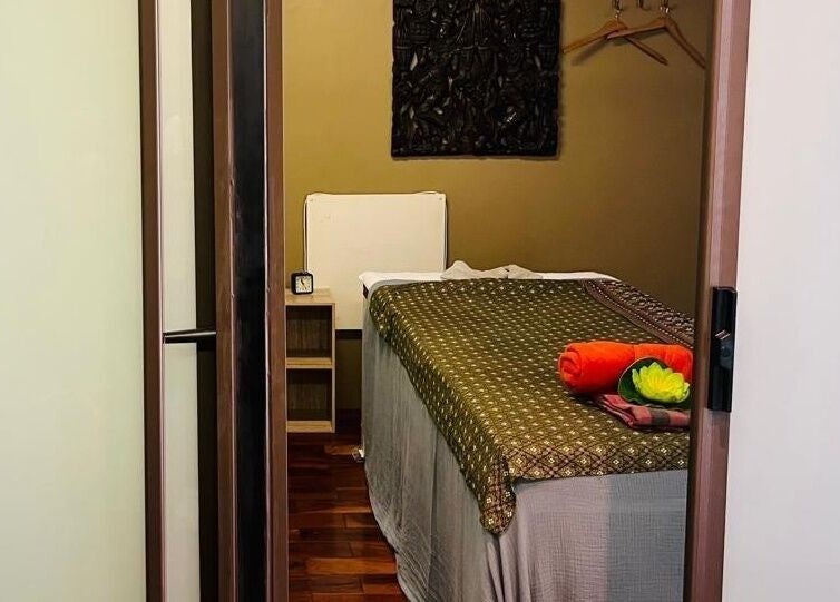 Tranquil massage room at Sby Spa Wellnesscenter in Sandton, Gauteng, ZA with a neatly prepared bed and decor.