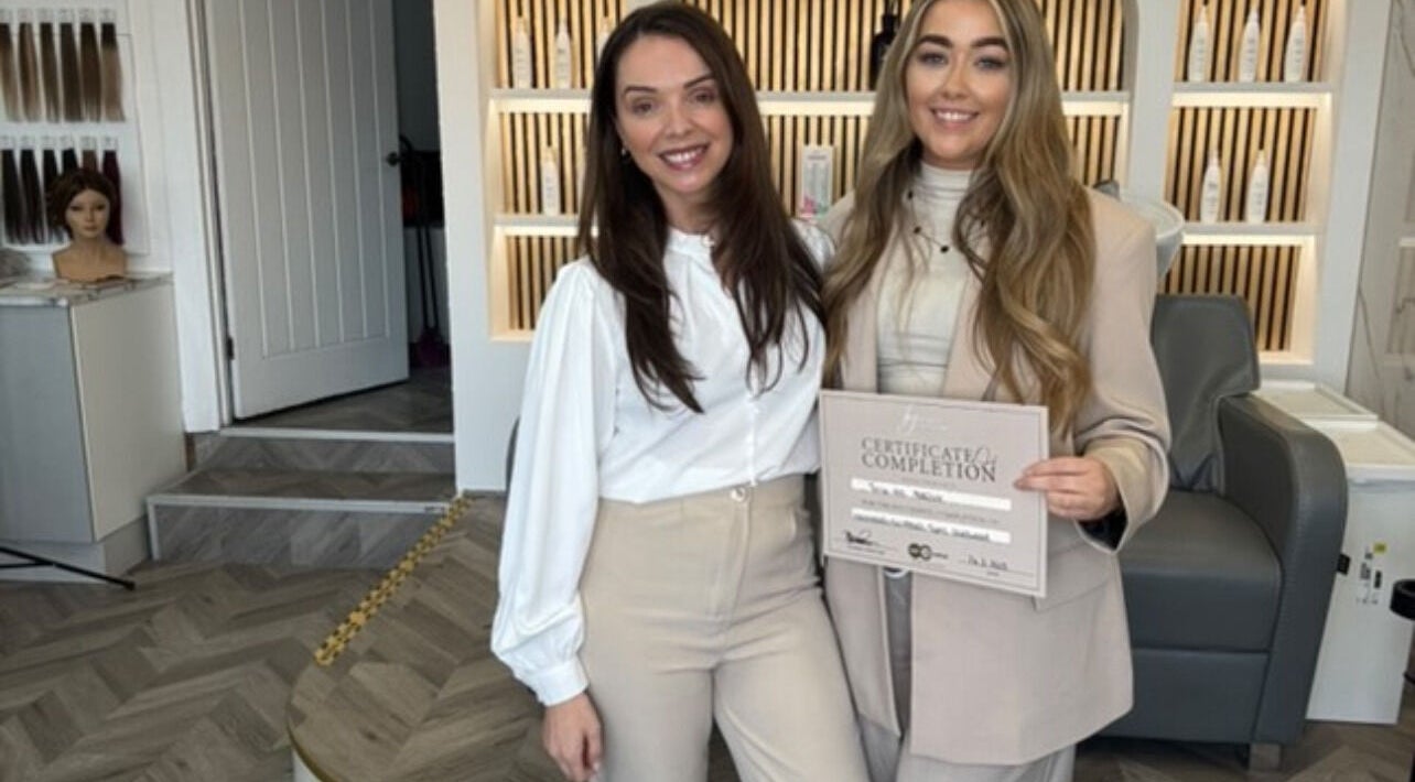 Stylists at Terrie-Ann Hair in Brigg, England, GB proudly showcasing a completion certificate.