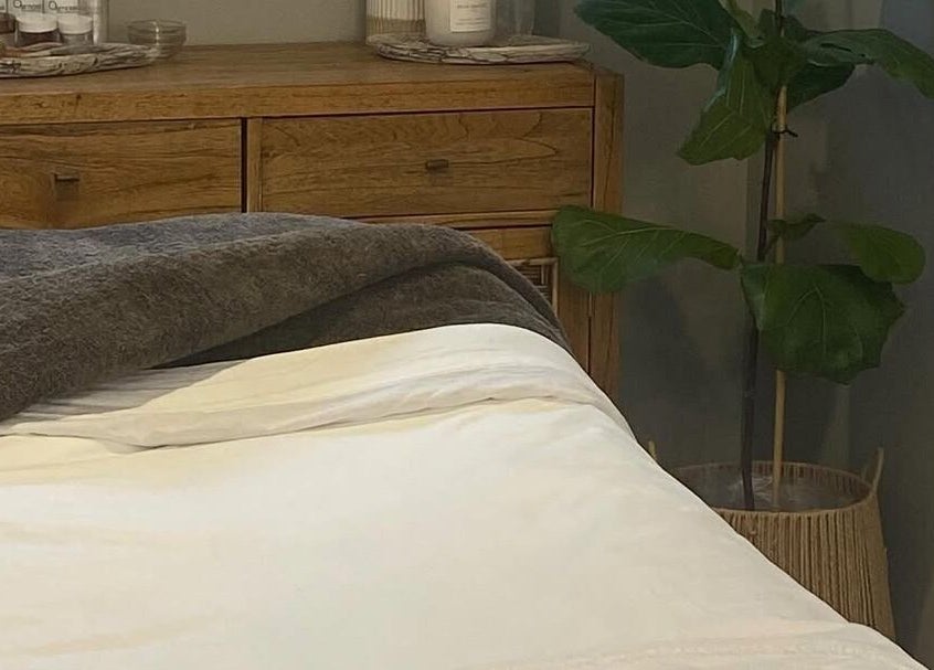 Cozy spa bed at Tonic Beauté in Auckland, NZ, offering ultimate relaxation and wellness.