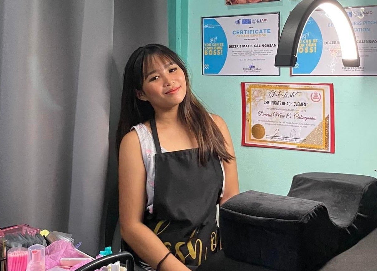 Lash artist at Blink by Decerie - Lash Romance in Olongapo, Central Luzon, PH, showcasing certificates on wall.