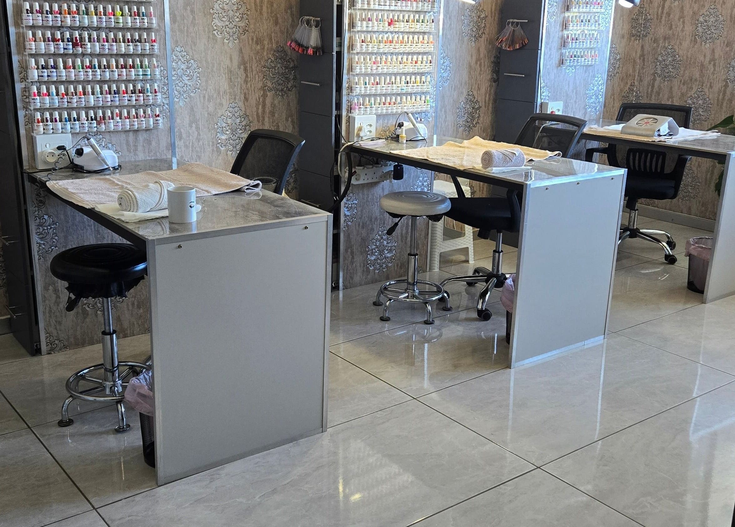 Modern nail salon at I Lipo Lab Modimall, Modimolle, Limpopo, ZA with elegant workstations and nail polish display.