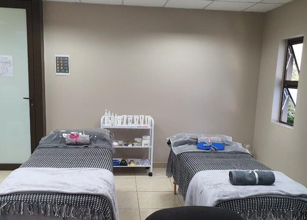 Two massage beds in a serene room at I Lipo Lab Modimall, Modimolle, Limpopo, ZA, ready for clients.