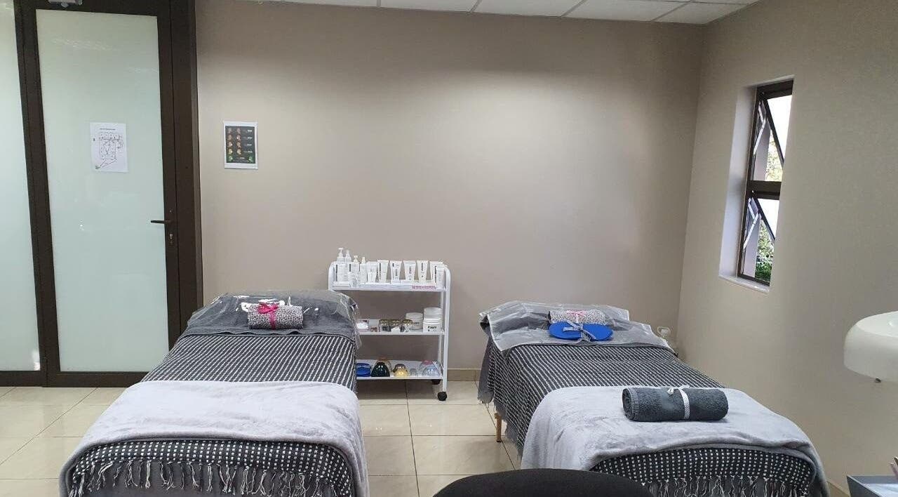 Two massage beds in a serene room at I Lipo Lab Modimall, Modimolle, Limpopo, ZA, ready for clients.