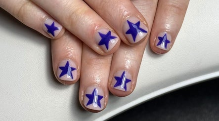 Blue star nail art at The Studio Nail Box, Cardiff, Wales, GB. Perfect for creative manicures.
