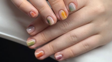 Colorful fall-themed manicure at The Studio Nail Box, Cardiff, Wales, GB showcasing artistic nail designs.