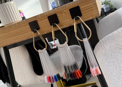 Elegant nail color display at The Studio Nail Box, Cardiff, Wales, GB showcasing diverse polish options.