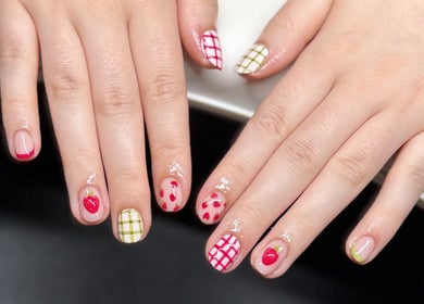 Intricate fruity nail art design at The Studio Nail Box, Cardiff, Wales, GB, showcasing creative manicures.