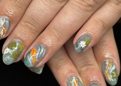 Intricate koi pond nail art at The Studio Nail Box, Cardiff, Wales, GB, featuring colorful fish designs.