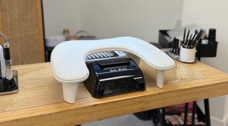 Elegant manicure station at The Studio Nail Box in Cardiff, Wales, GB, showcasing tools and equipment.