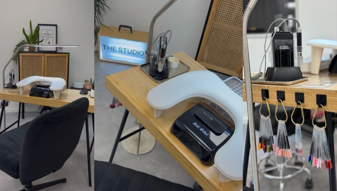 Modern manicure station at The Studio Nail Box, Cardiff, Wales, GB showcasing equipment and nail polish samples.