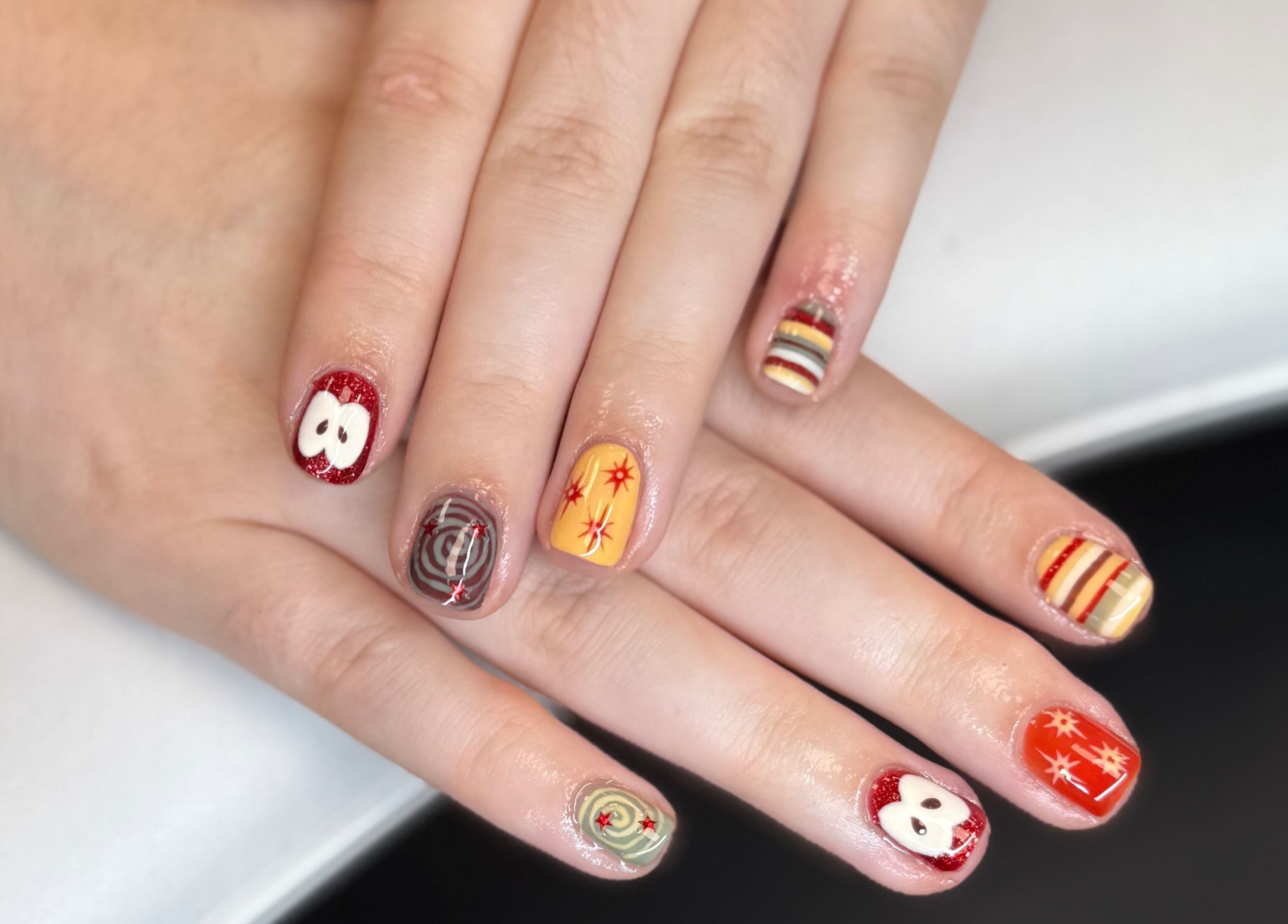 Colorful nail art at The Studio Nail Box, Cardiff, Wales, GB showcases intricate designs.