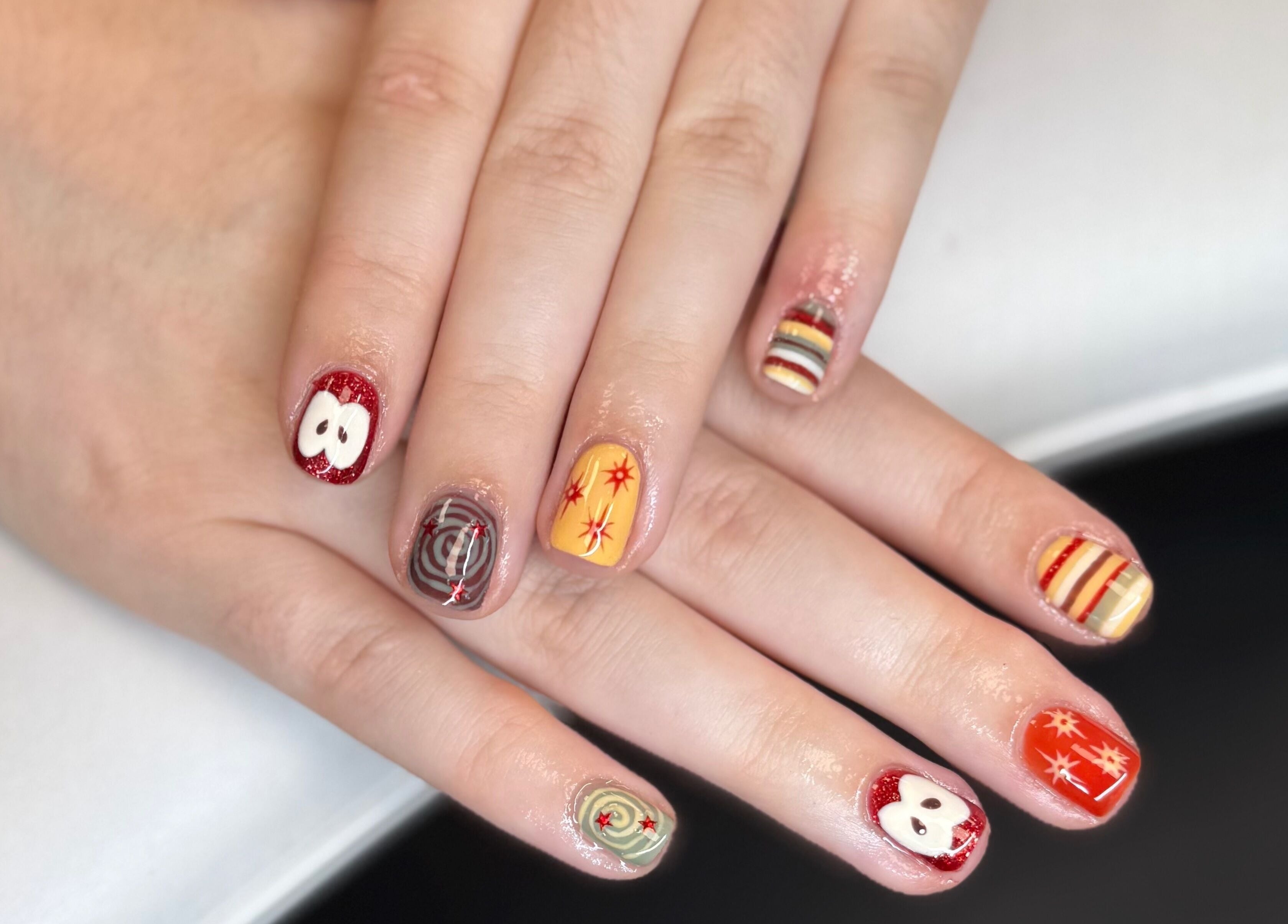 Colorful nail art at The Studio Nail Box, Cardiff, Wales, GB showcases intricate designs.