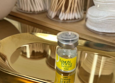 Lemon Bottle skin booster on a golden tray at The Cheshire Retreat Academy Ltd, Hale, England, GB.