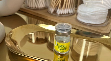 Lemon Bottle skin booster on a golden tray at The Cheshire Retreat Academy Ltd, Hale, England, GB.