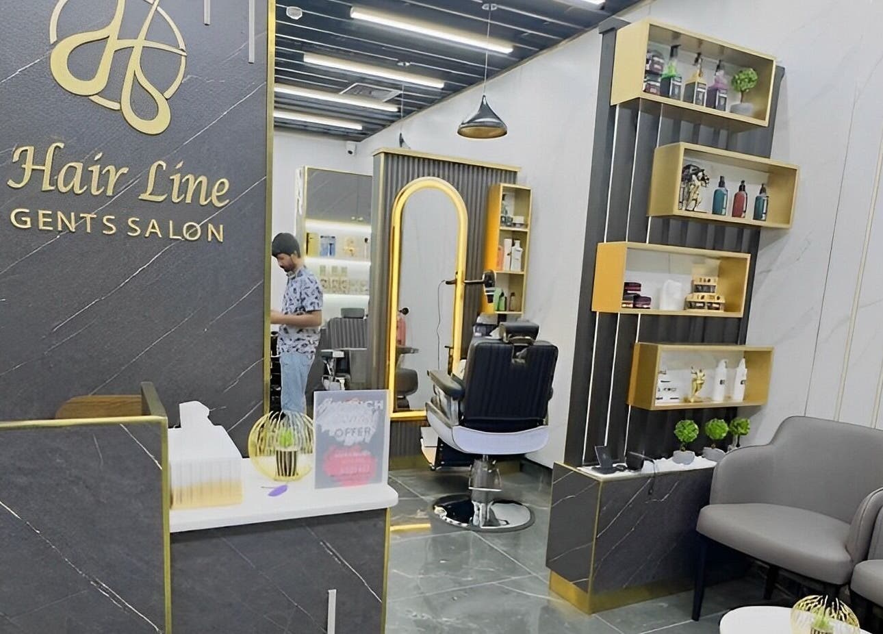 Stylish interior of Hair Line Gents Salon in Sharjah, showcasing modern chairs and grooming area.