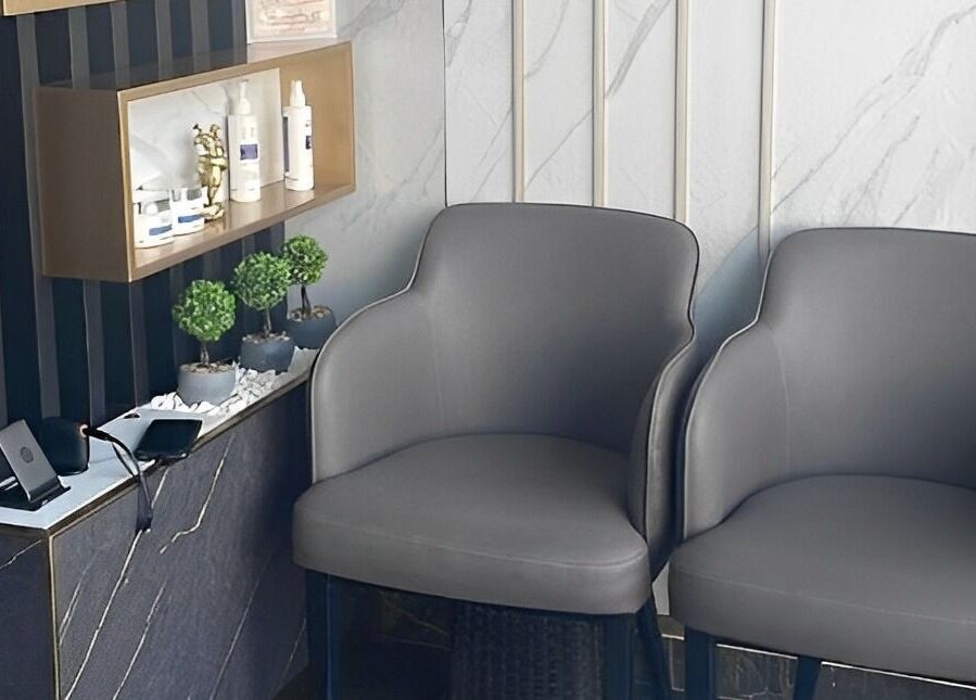 Elegant waiting area in Hair Line Gents Salon - Al Jada, Sharjah, AE, featuring stylish seating and decor.