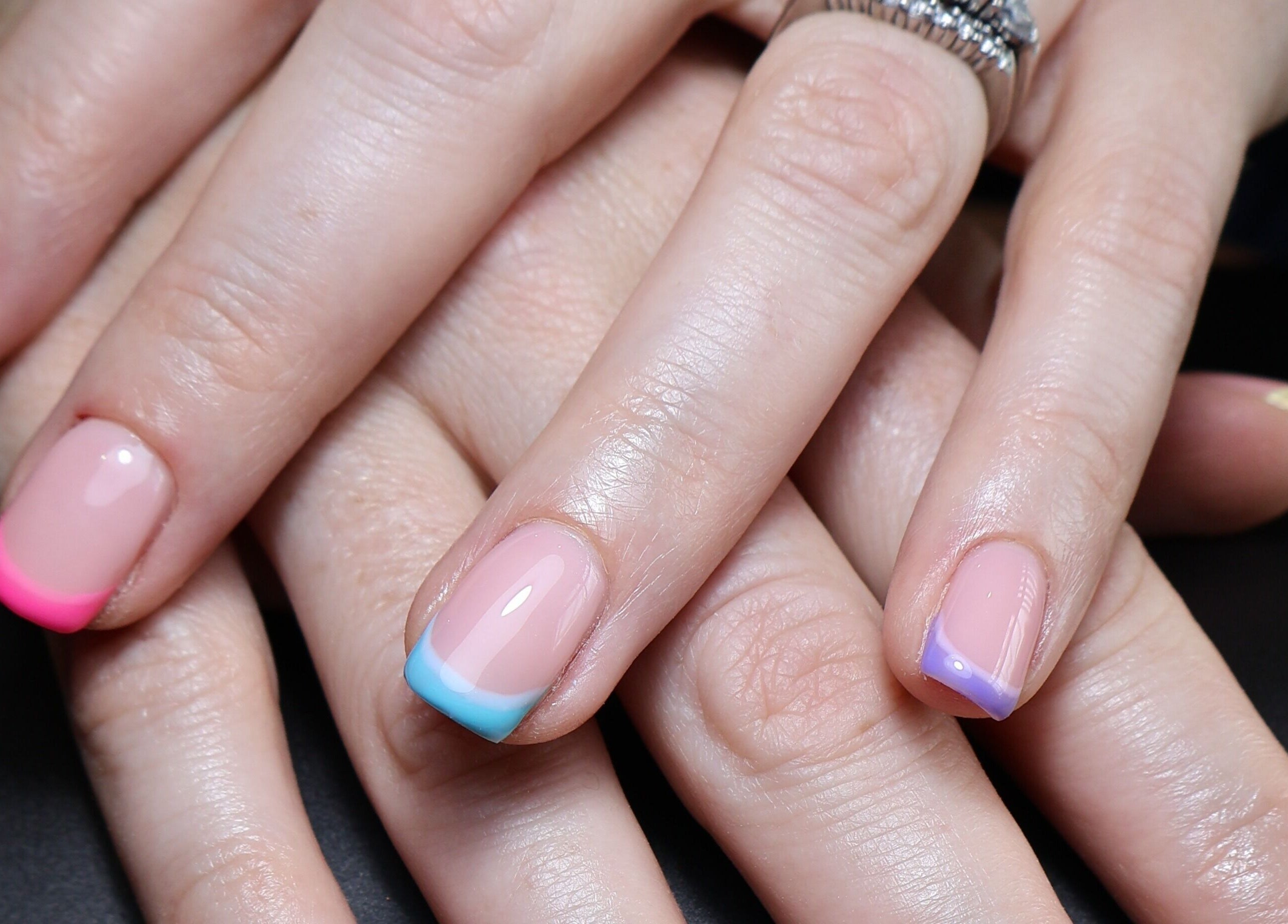 Colorful French manicure at O'Nails, Newry, Northern Ireland, GB showcasing vibrant nail art.
