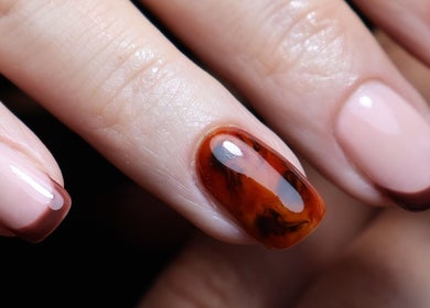 Stylish nail art design at O'Nails, Newry, Northern Ireland, GB featuring elegant brown and caramel hues.