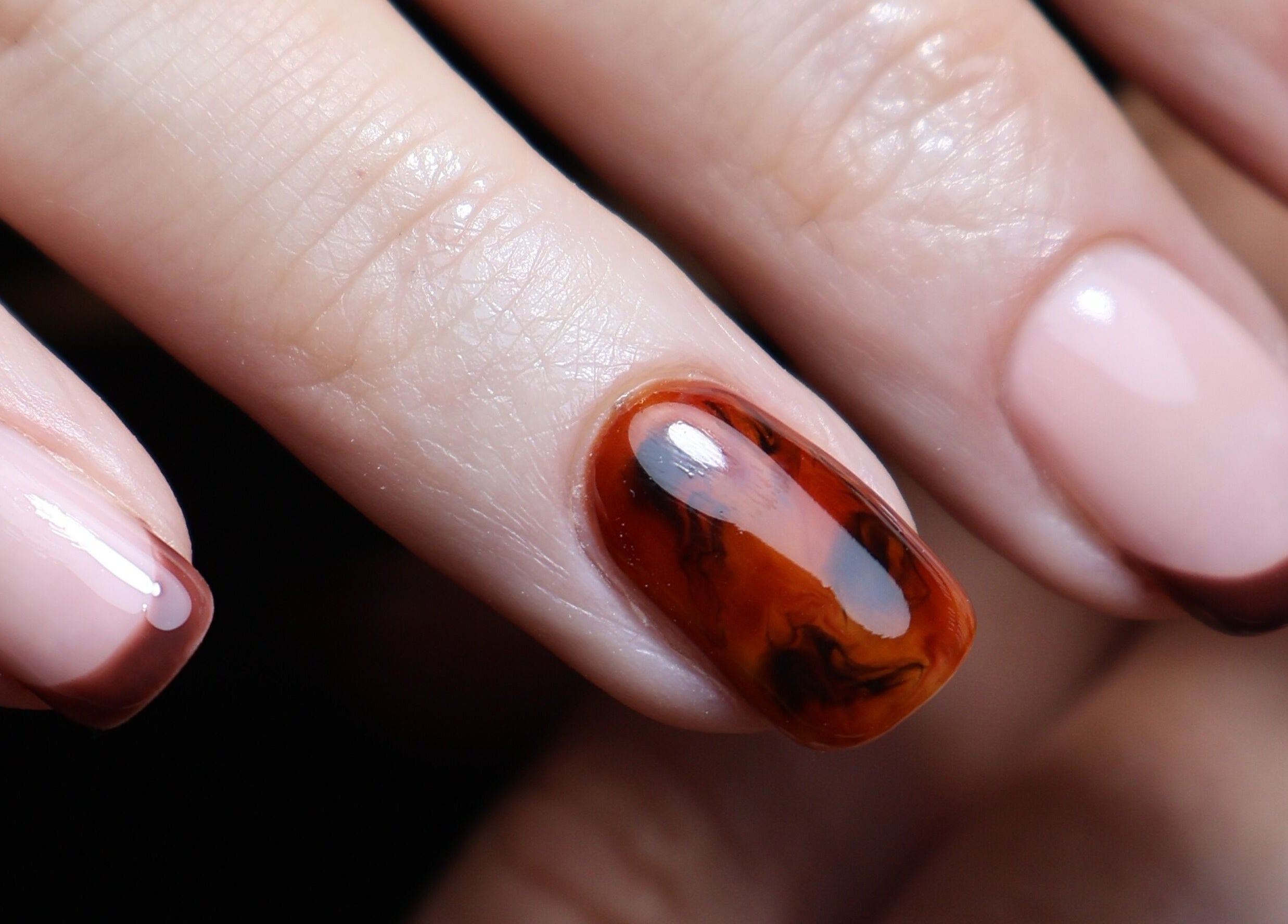 Stylish nail art design at O'Nails, Newry, Northern Ireland, GB featuring elegant brown and caramel hues.